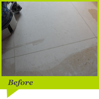 A limestone floor before cleaning
