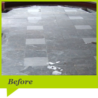 A marble floor before cleaning